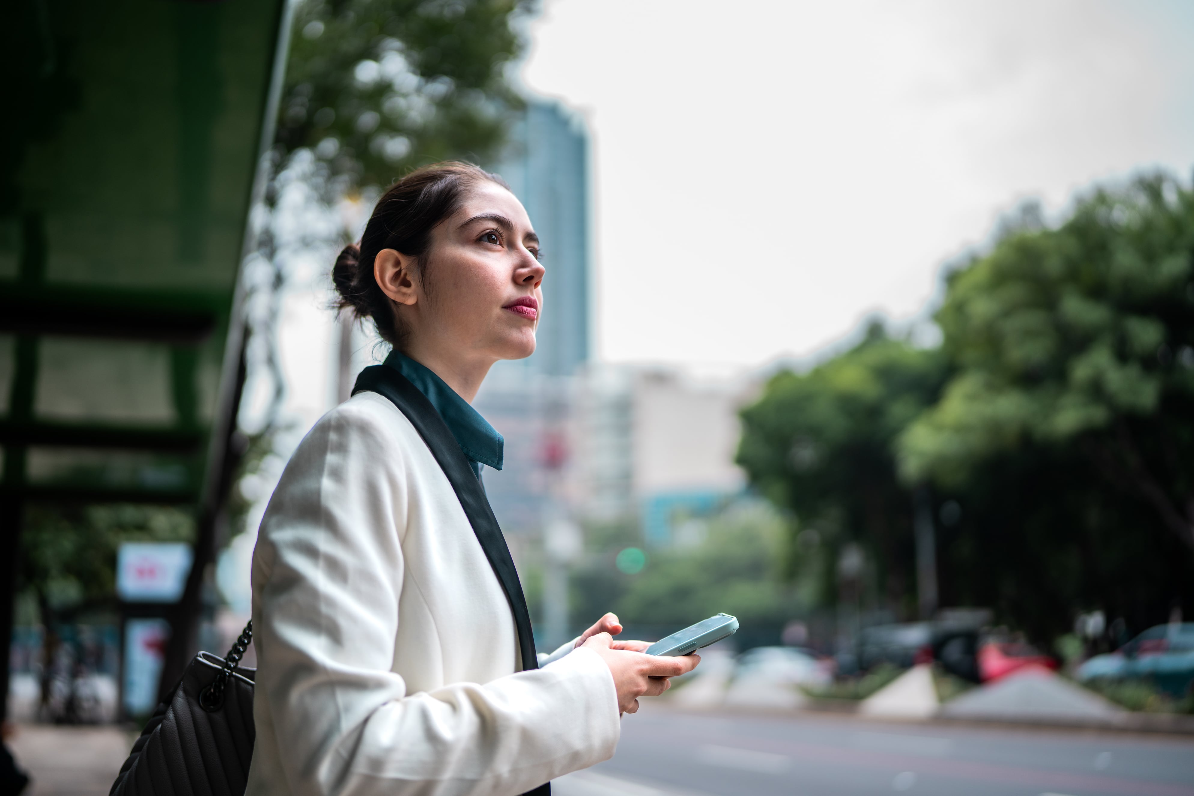 Woman crossing the street while considering EOR services in Mexico.