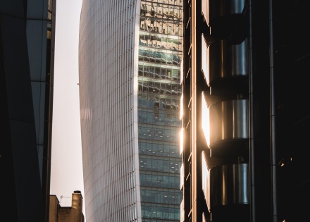 Sunset reflecting off a skyrise building in a city downtown
