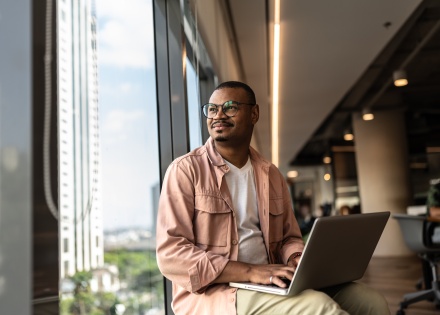 HR manager looking out the window while researching work visas in Egypt