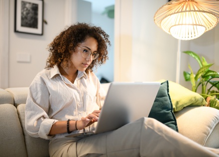 Business owner researching risk mitigation strategies during trade uncertainty