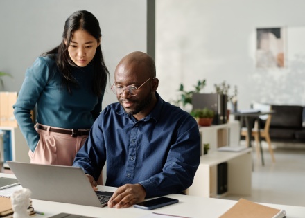Colleagues reading about how to get work authorization in Czechia