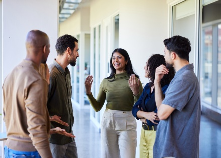 Coworkers discussing how an EOR can help their business expand globally