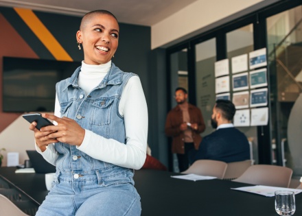 Global HR manager researching Réunion work visas in their phone