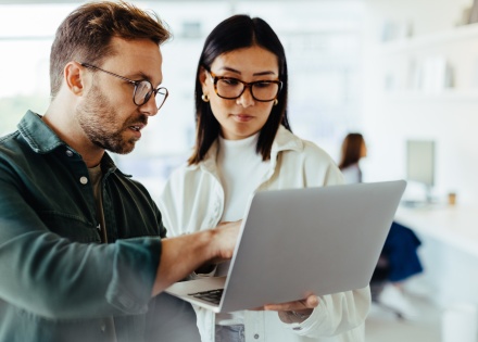 Two coworkers discussing how to get work authorization in Netherlands