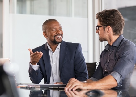 Global HR managers discussing remote team employee training programs