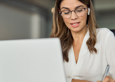 Woman looking at laptop