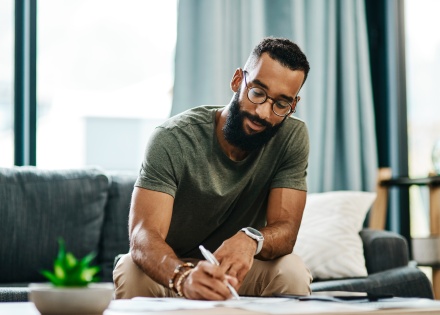 Employee reviewing invoice payment terms to ensure timely payment