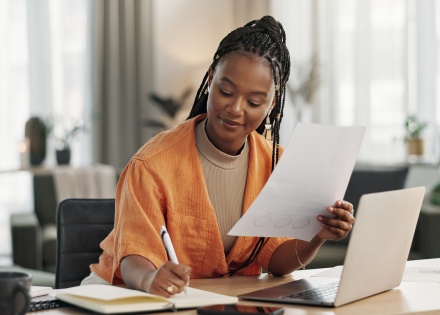 CHRO going over paperwork to hire in Cameroon compliantly.