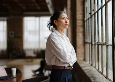 HR leader standing by an office window