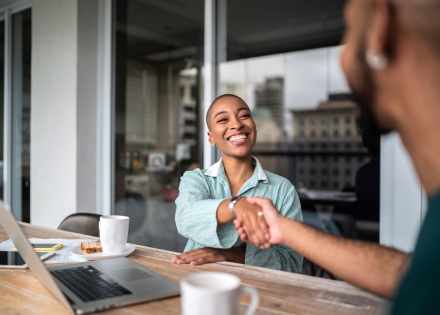 Woman shaking hands after discussing salary in Azerbaijan