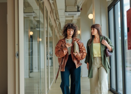 Global HR managers walking and discussing payroll tax in Algeria