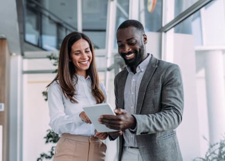 Two colleagues working together in a modern office