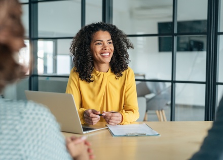 Businesswoman having a conversation about salary in Latvia