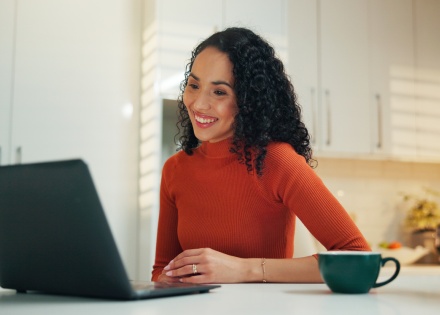 Smiling woman working from home in Ecuador