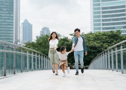 Chinese family walking and exploring a city during a Chinese public holiday