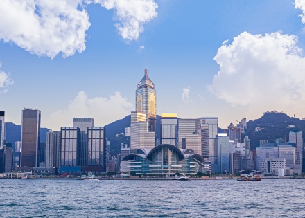Victoria Harbor and Hong Kong Island skyline with clouds