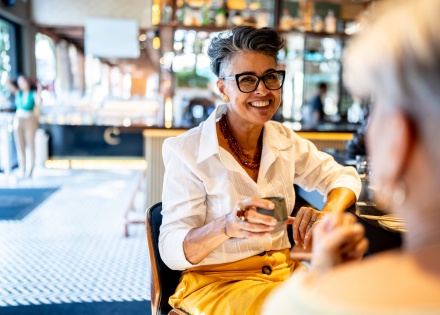 Businesswoman chatting and drinking tea while celebrating a public holiday in Burundi