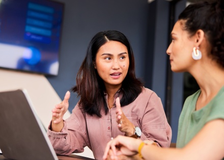 Global HR managers discussing the best talent management software