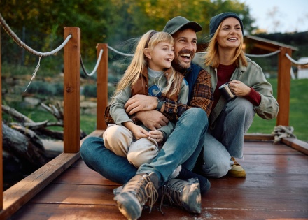 Smiling family on a dock enjoying Belarus’s public holidays
