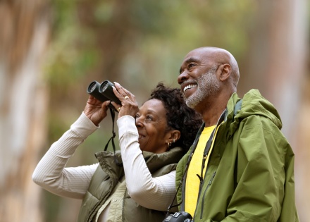 Couple bird watching and hiking during Benin’s public holidays