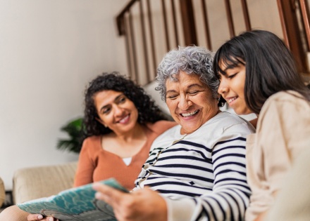 Family looking through a photo album during Uzbekistan’s public holidays