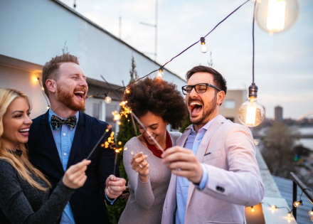 Friends celebrating a Danish public holiday with sparklers