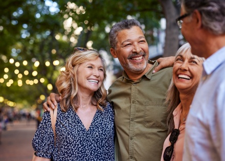 Group of happy senior friends sharing a moment outdoors