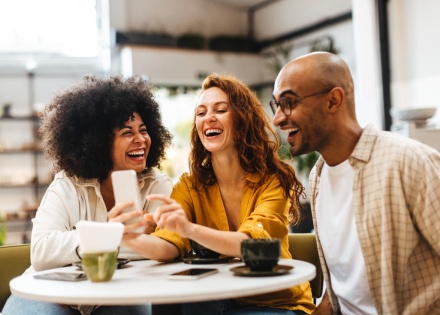Friends laughing together during Togo’s public holidays