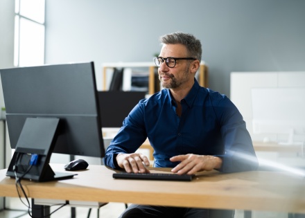 Male accountant using business computer in office