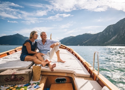 Couple on a boat on a lake enjoying Switzerland’s public holidays