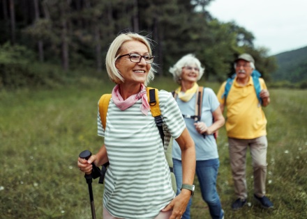 Friends smiling on a hike during Tajikistan's public holidays