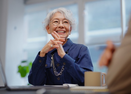 Senior businesswoman discussing payroll taxes in Guinea-Bissau