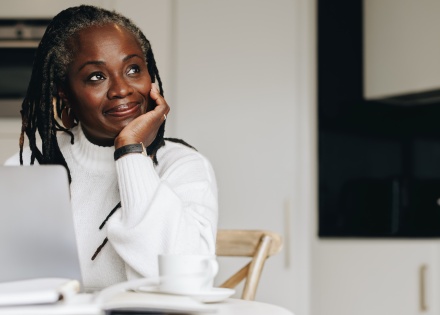 Senior businesswoman in her home office doing payroll taxes in French Guiana