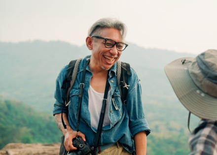 Couple hiking together on a mountain top during Bahrain’s public holidays