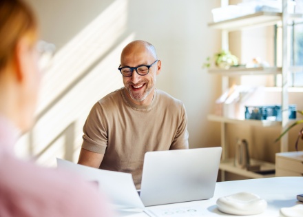 Smiling man having a business meeting about business etiquette in Sweden