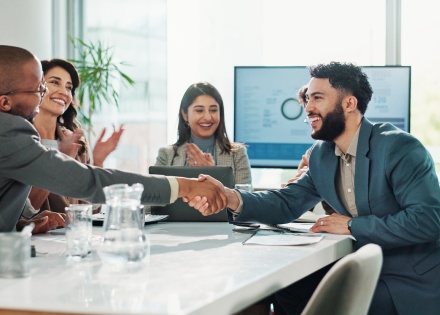 Colleagues shaking hands during a business meeting