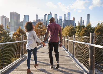 Couple walking across a bridge enjoying Bolivia’s public holidays