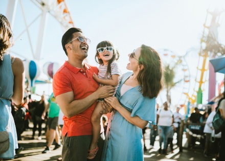 Family at a fair enjoying the United States's public holidays