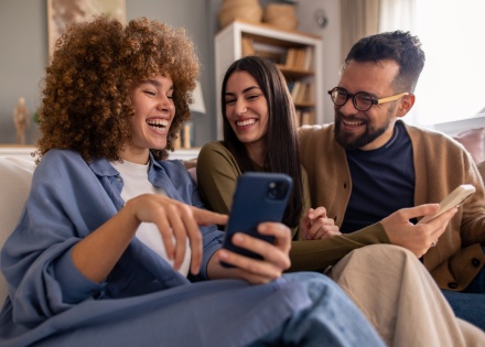 Friends relaxing in a living room during Tonga's public holidays
