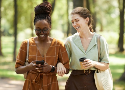Friends walking in a wooded park enjoying Algeria’s public holidays