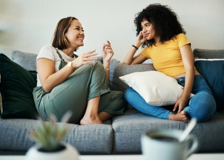 Friends relaxing and chatting on a couch during Ukraine’s public holidays