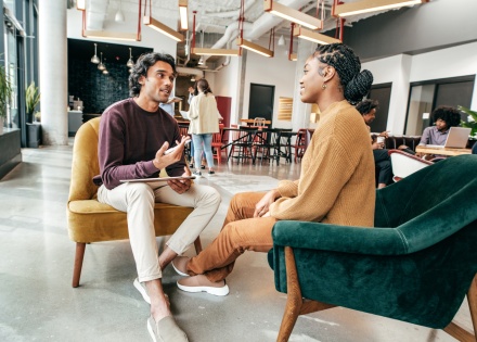 Men and woman talking about business in casual office