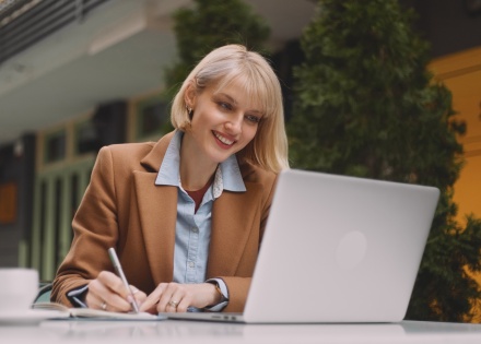 Woman smiling with laptop