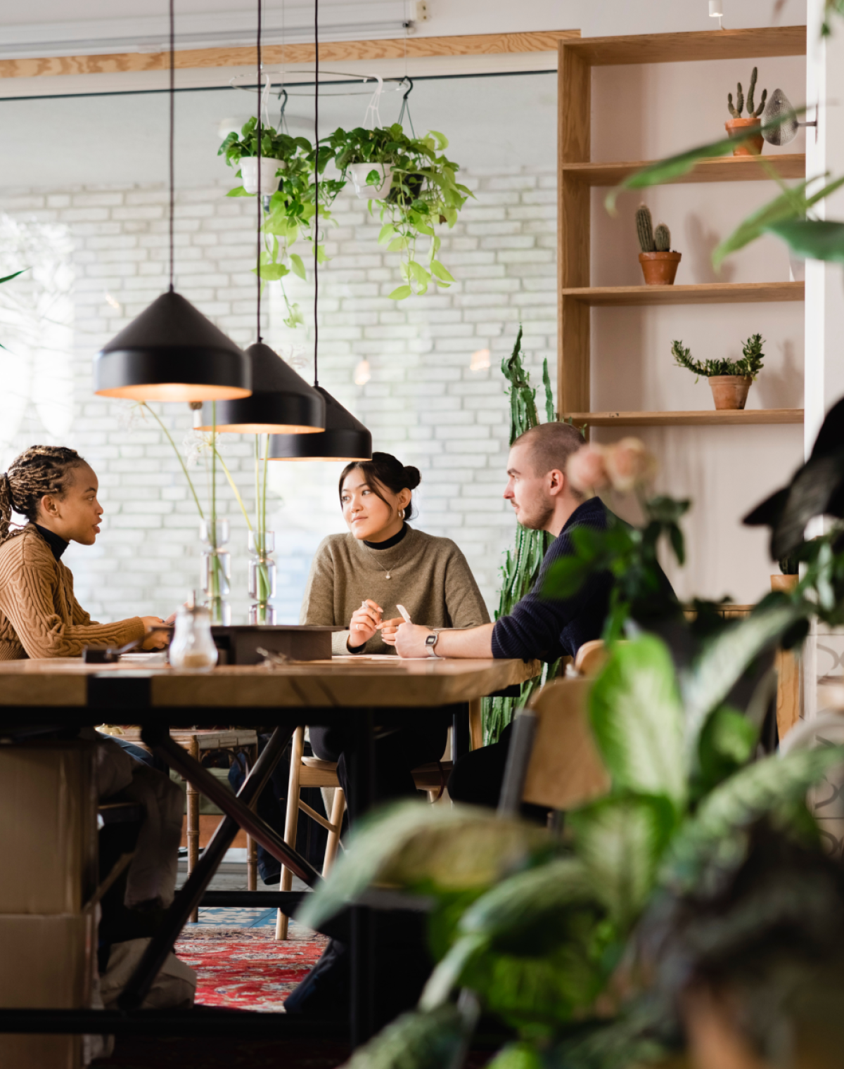 People sitting around a large table having a conversation