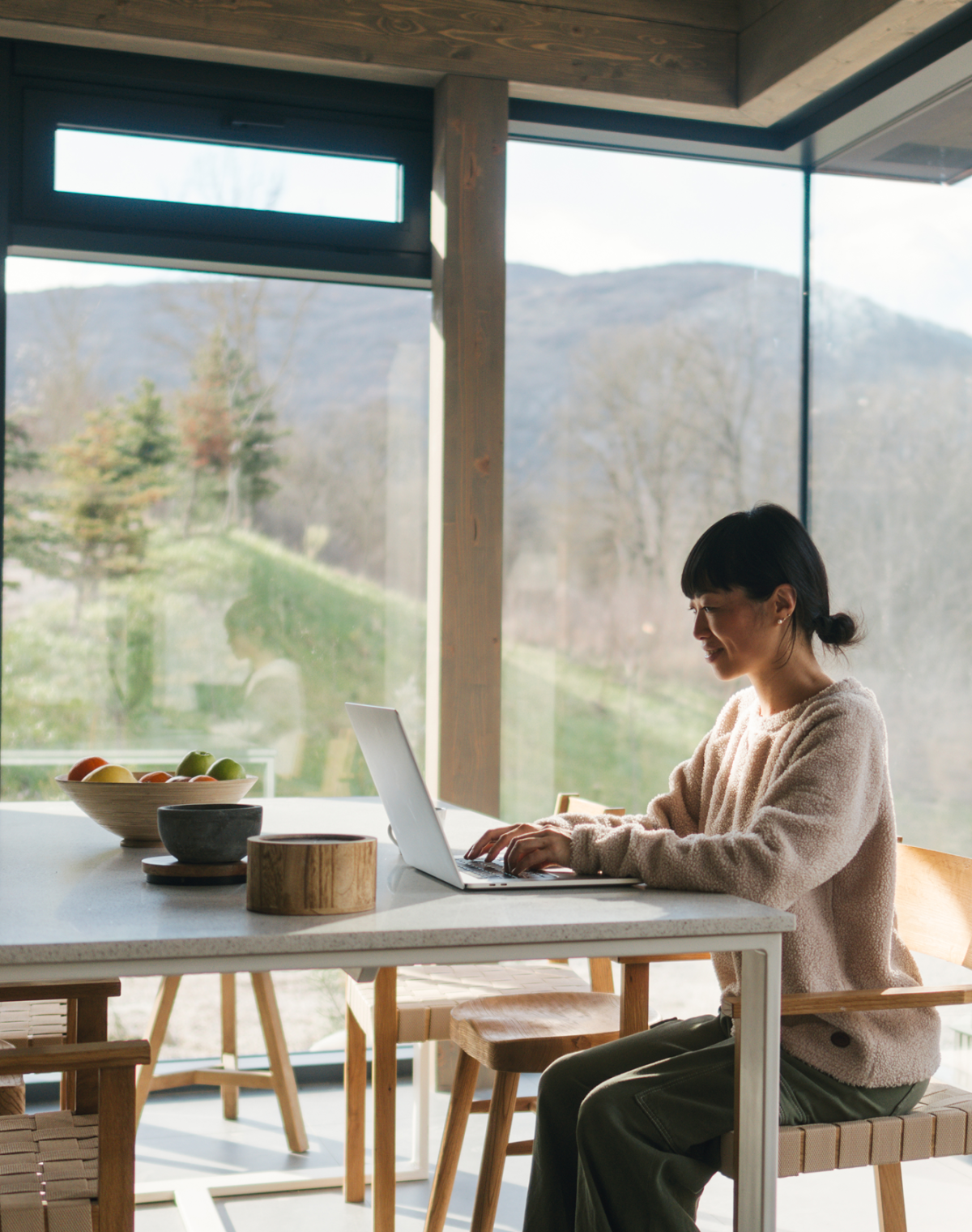 Global HR professional researching contractor management software on her laptop