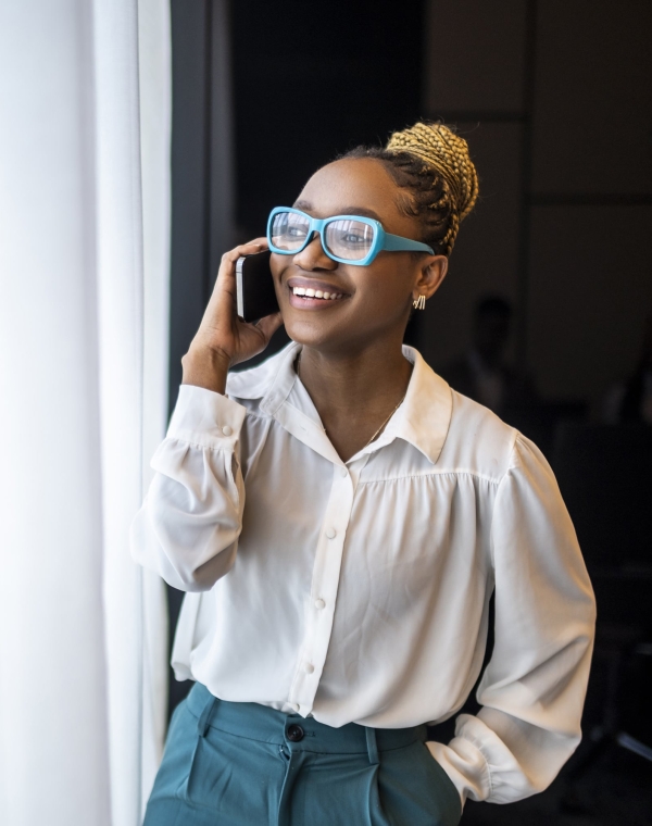 Woman in professional setting on phone discussing EOR options