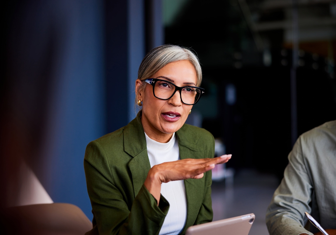 Financial industry businesswoman in meeting discussing global expansion with EOR.