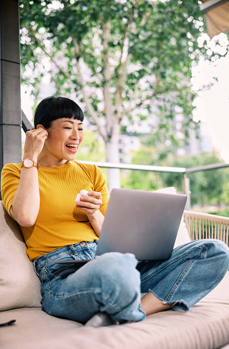 Employee using a laptop to learn about H-1B visa alternatives