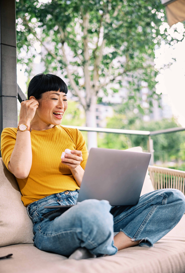 Employee using a laptop to learn about H-1B visa alternatives