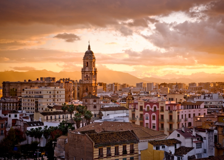 The city of Malaga in Andalusia in southern Spain at sunset.